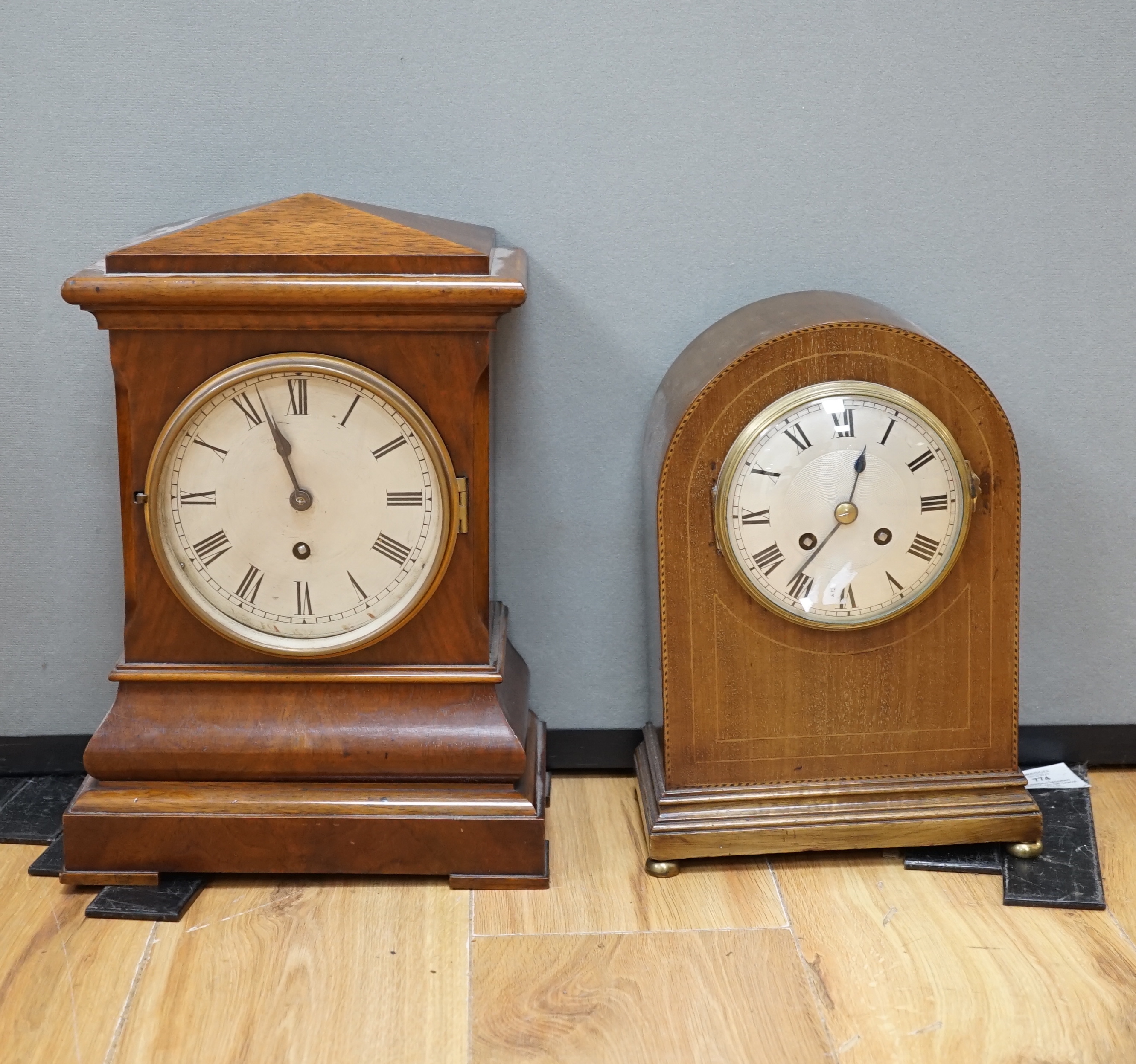 Two early 20th century mantel clocks; a mahogany timepiece and an inlaid Edwardian clock with engine turned face, striking on a coiled gong, tallest 35cm